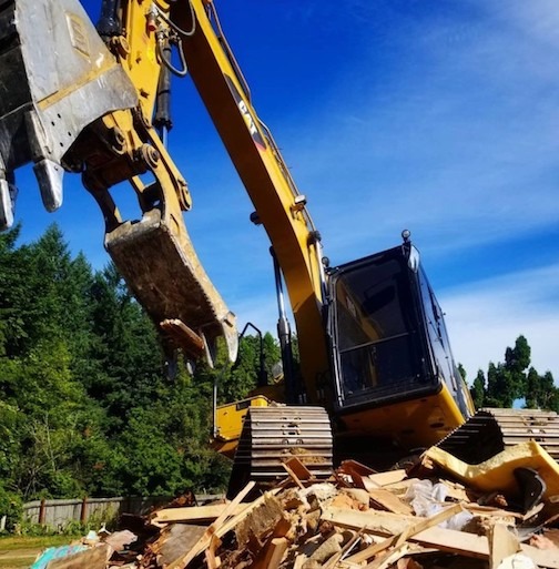 image of excavator doing demolition.