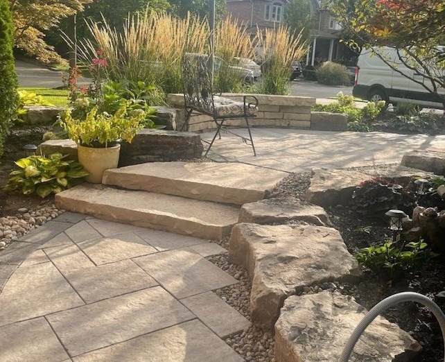 paver stone sidewalk and natural stone stairs